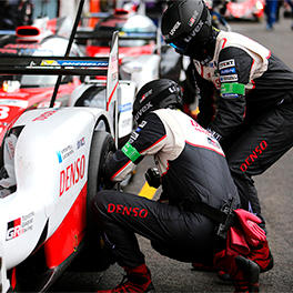 Two mechanics are changing the tyre.