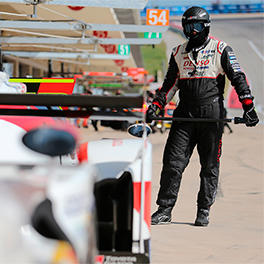 The lollipop man is standing the fronnt of TS050 HYBRID in the pit lane of the Circuit of the Americas